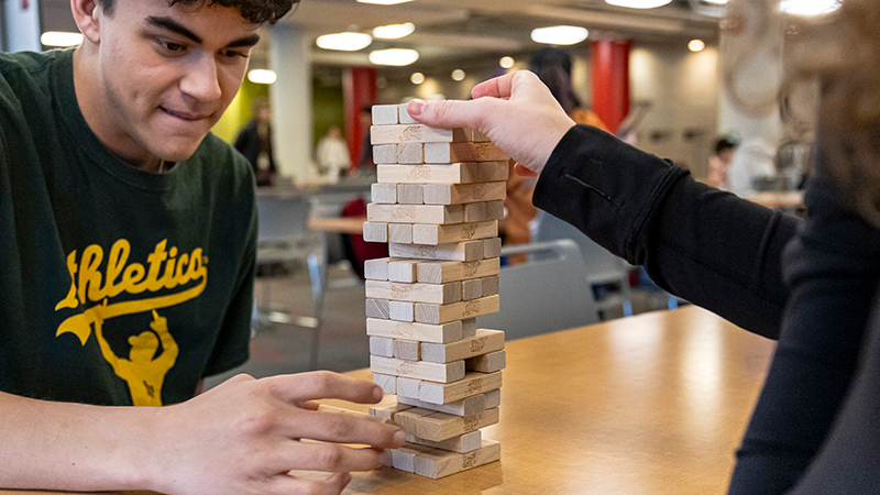 students play jenga
