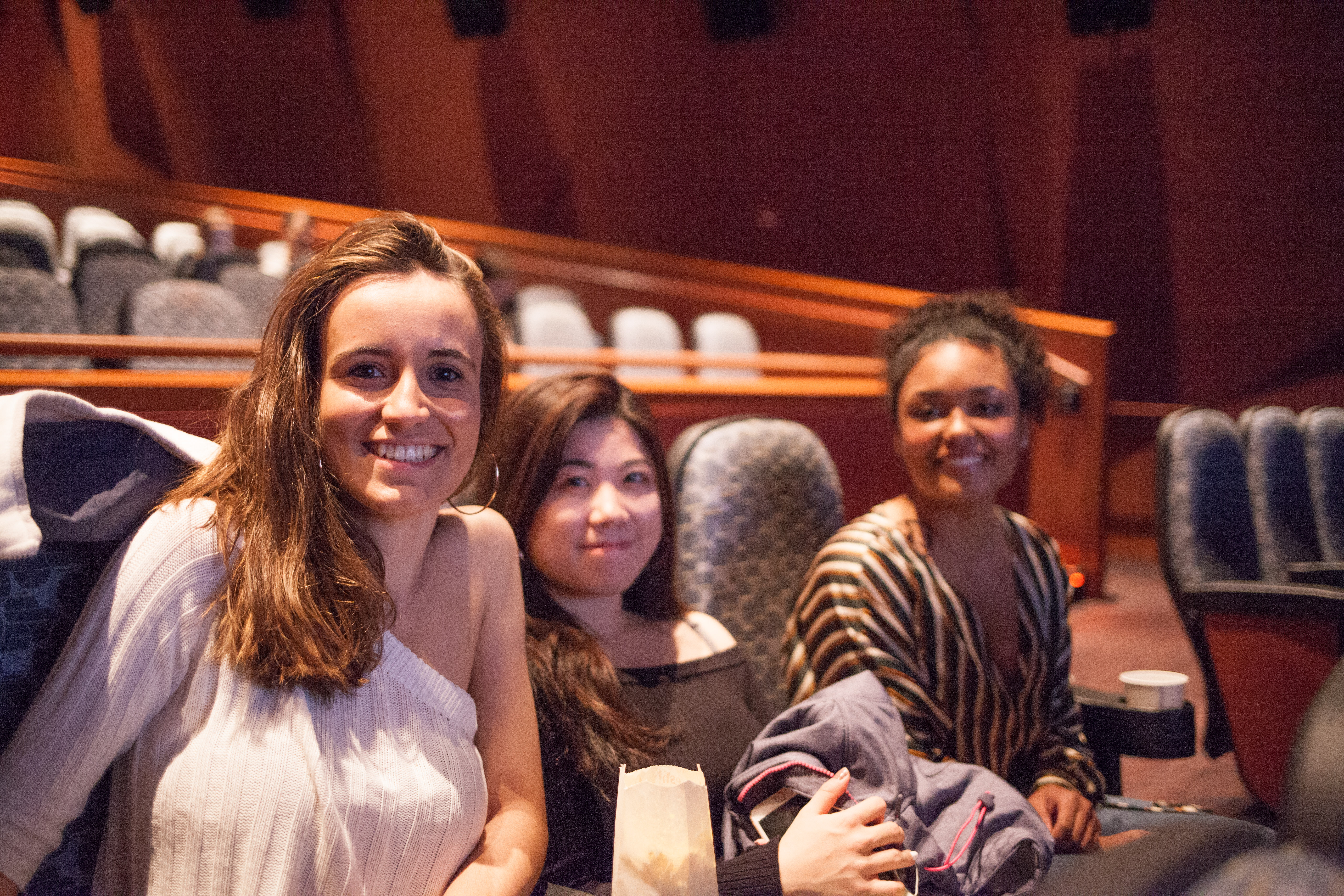 Three girls at a movie