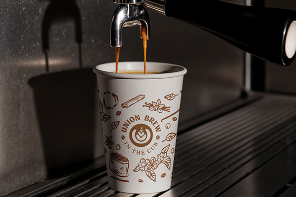 paper cup and espresso machine with text "Union Brew in the CUB"